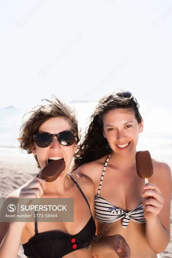 Women eating ice cream on beach
