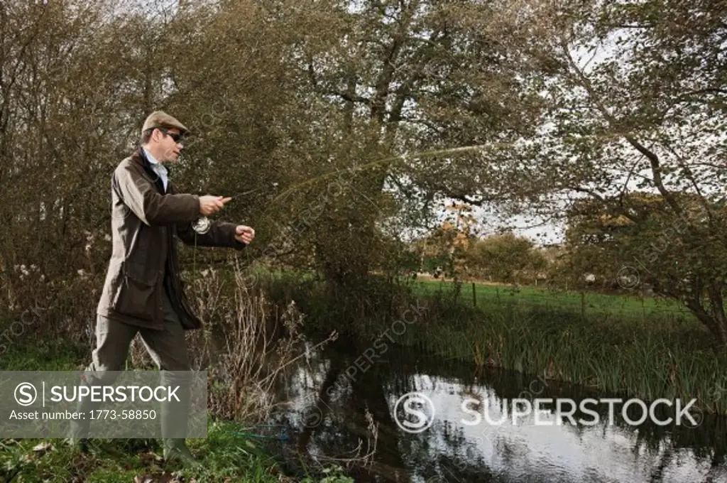 Man fly fishing on the English countryside
