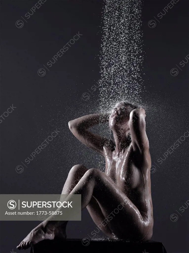 Woman washing her hair in shower