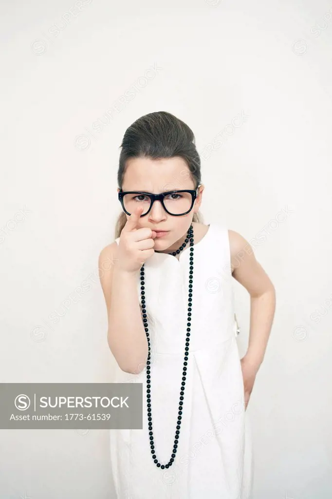 Frowning girl wearing eyeglasses