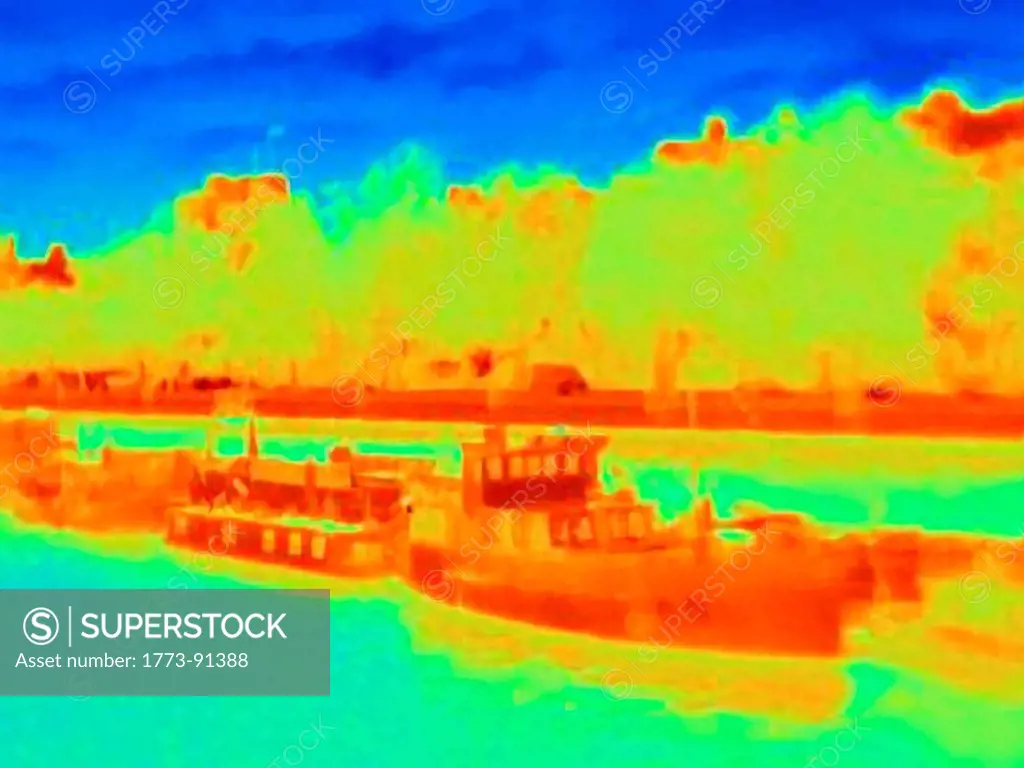 Thermal image of boats on urban river