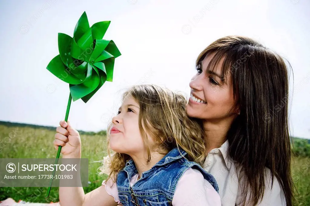 Woman and girl with toy windmill