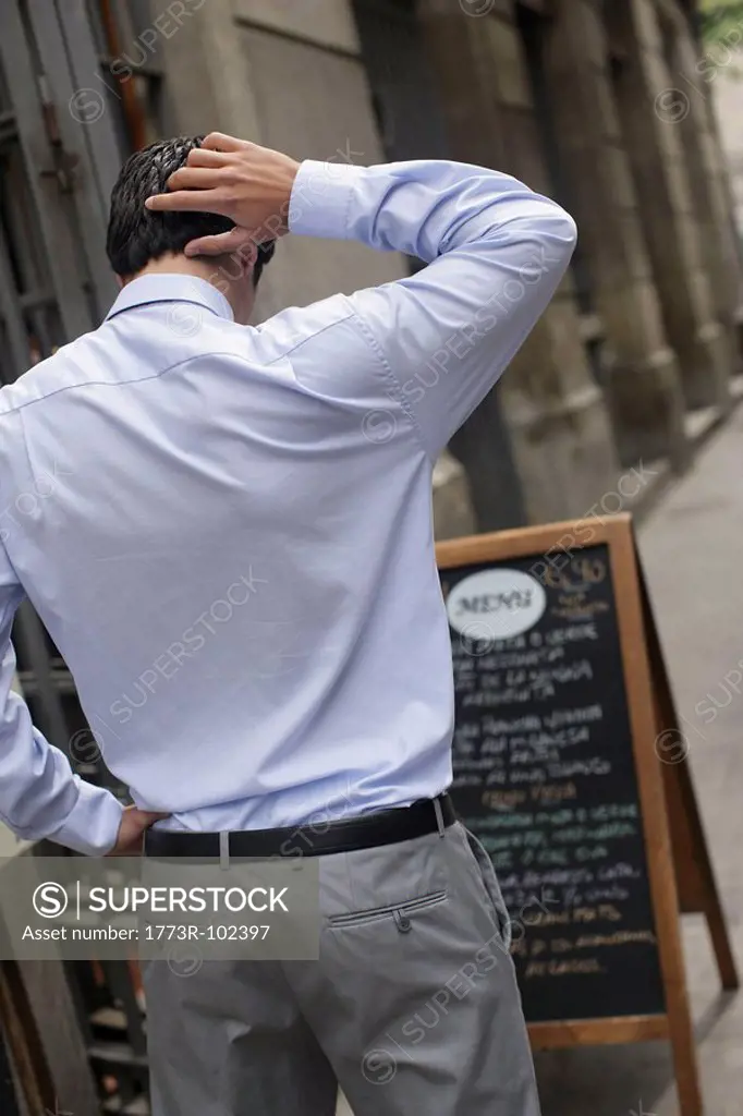 Business man looking at menu
