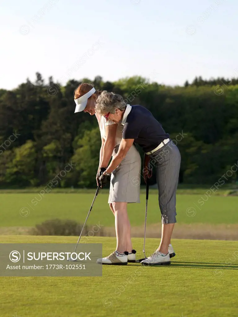 Two women on golf green