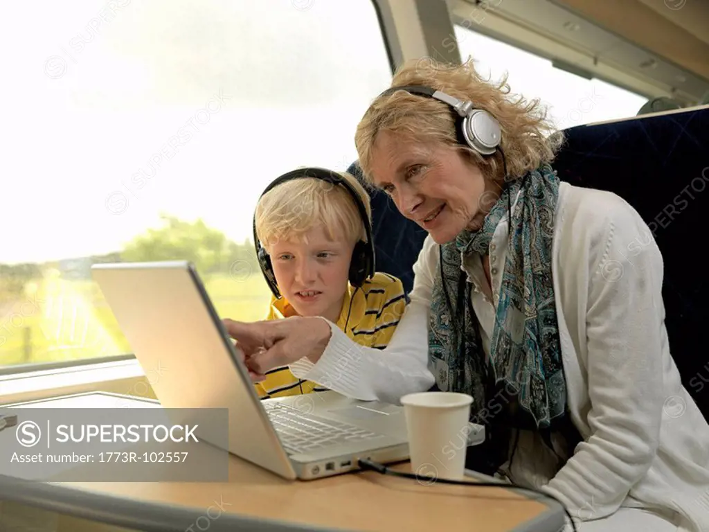 Grandmother and grandson on train