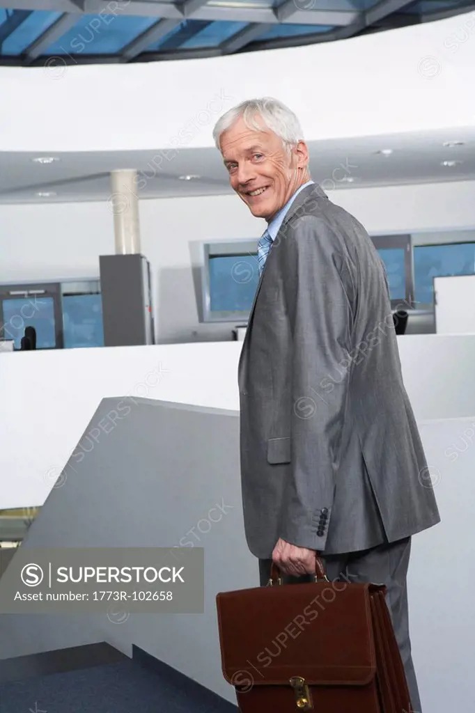 Mature businessman on stairs
