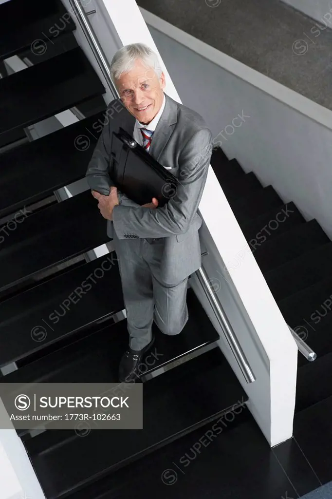 Businessman standing on stairs