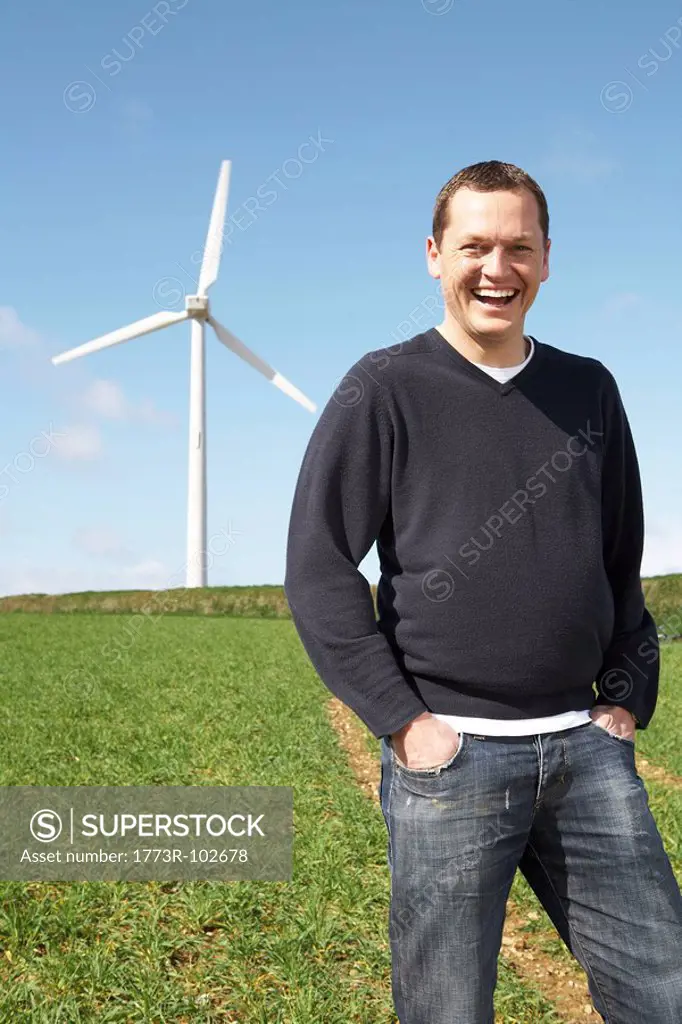 Man smiling on a wind farm