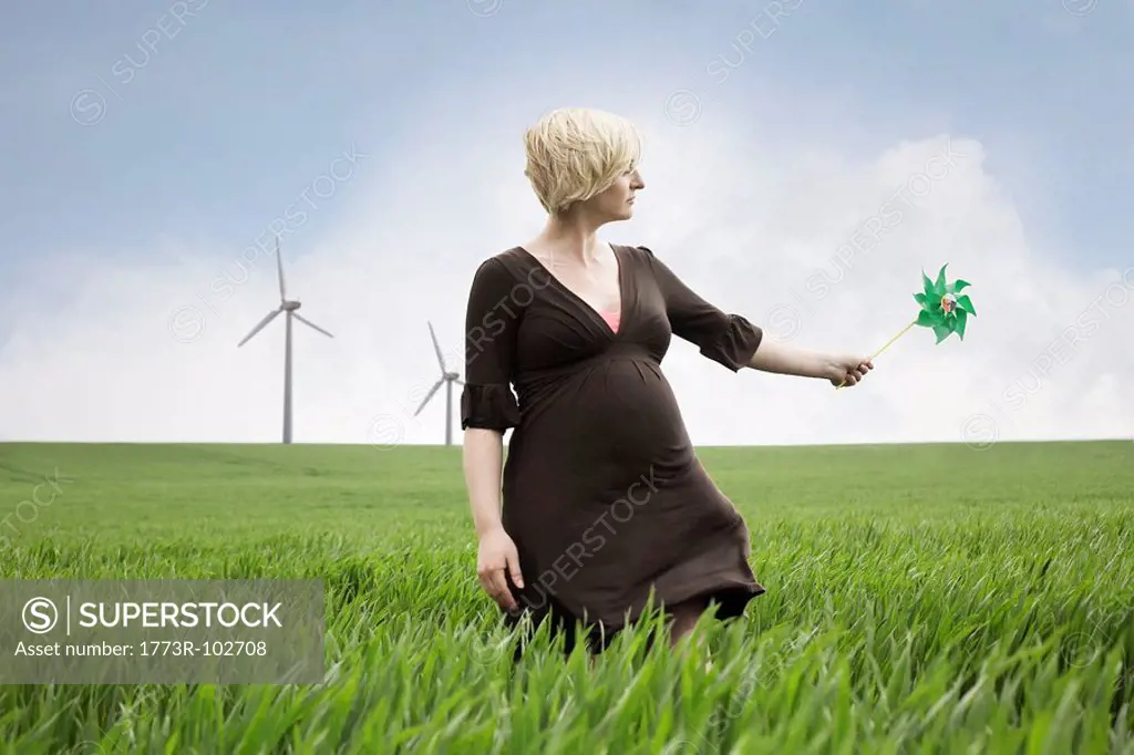 Pregnant woman playing with windmill
