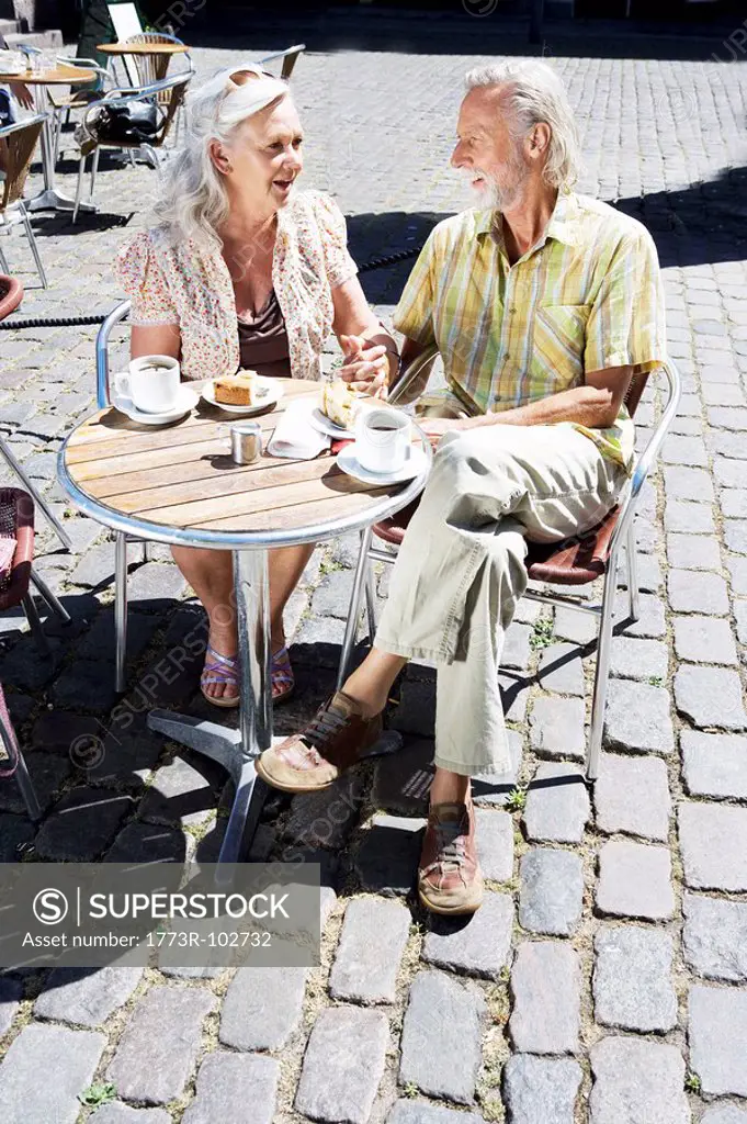 Couple sitting at café table