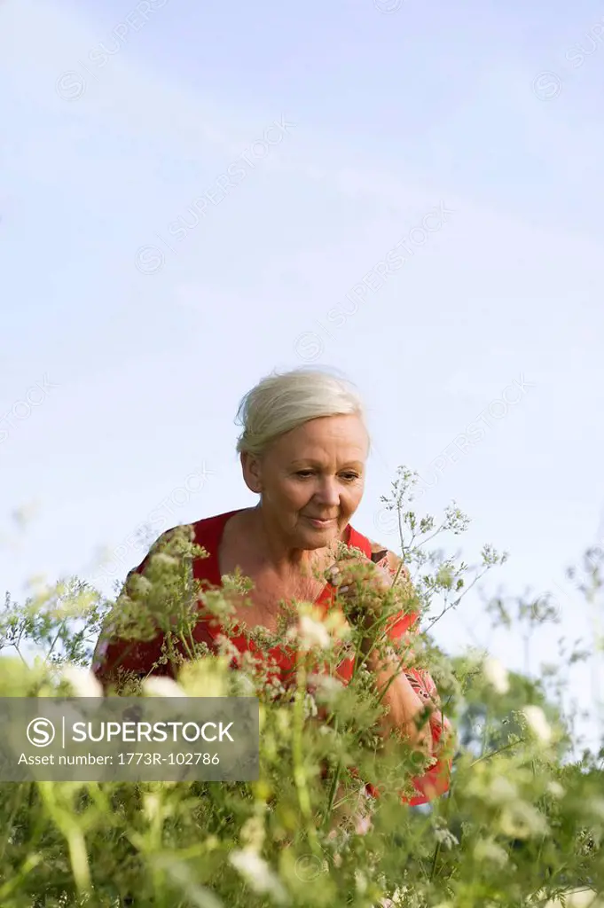 Portrait of mature woman with flowers