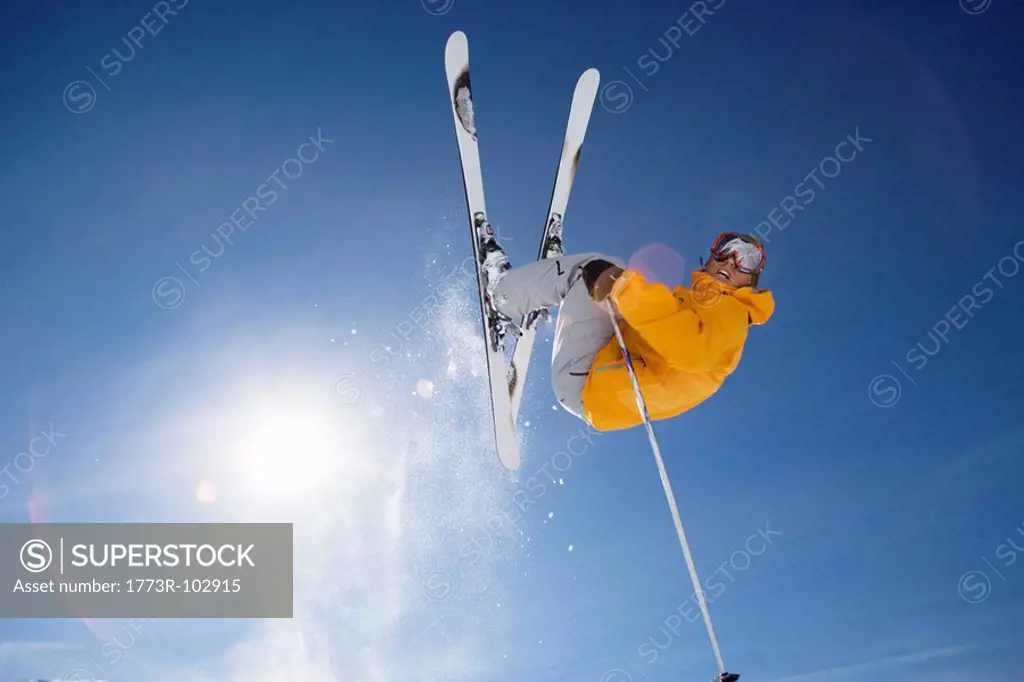 Skier jumping shot from bellow
