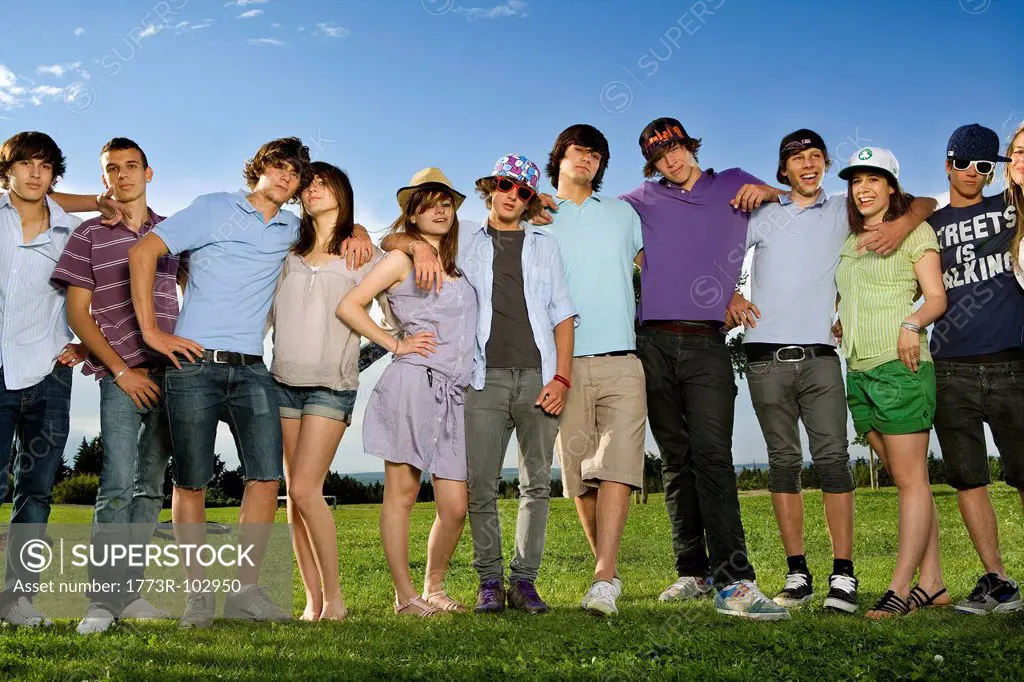Teen group portrait standing in park
