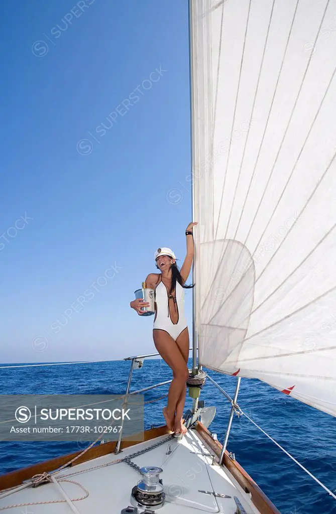 Woman on sail boat with champagne