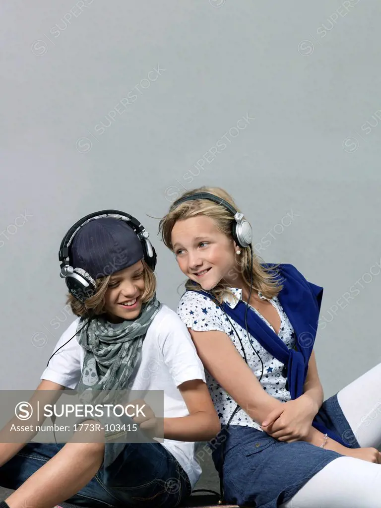 Two kids with head phones