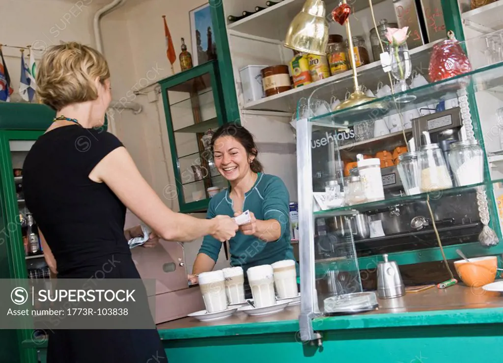 Female barista helping a female customer