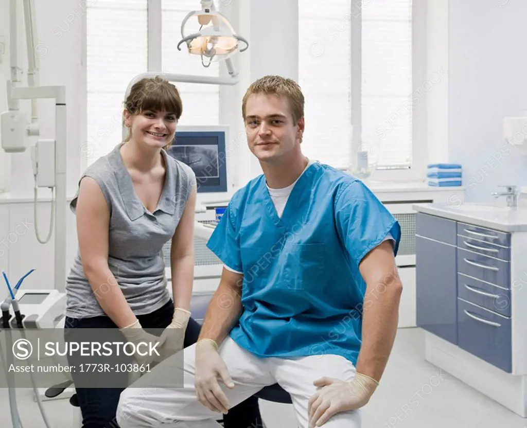Portrait of a dentist with assistant