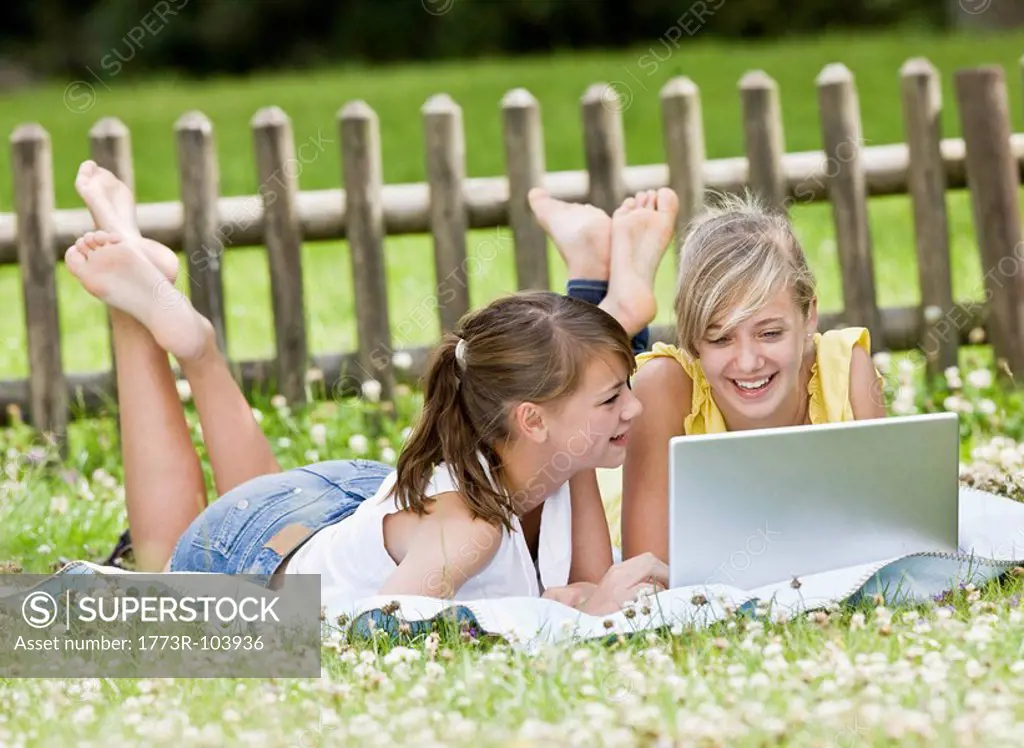 Young girls playing on a computer