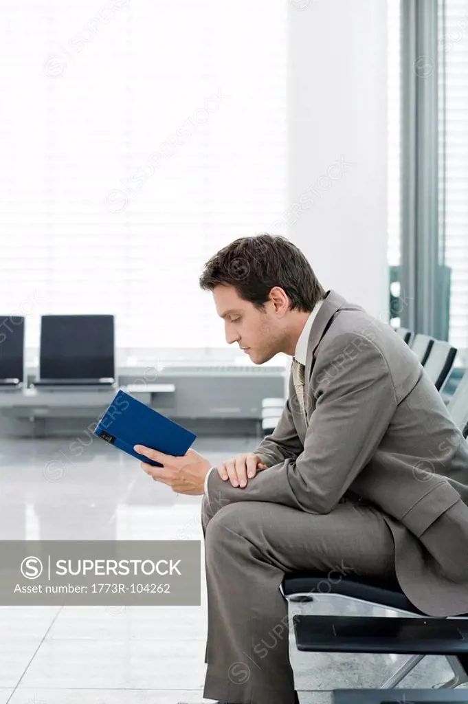 Man sitting reading book