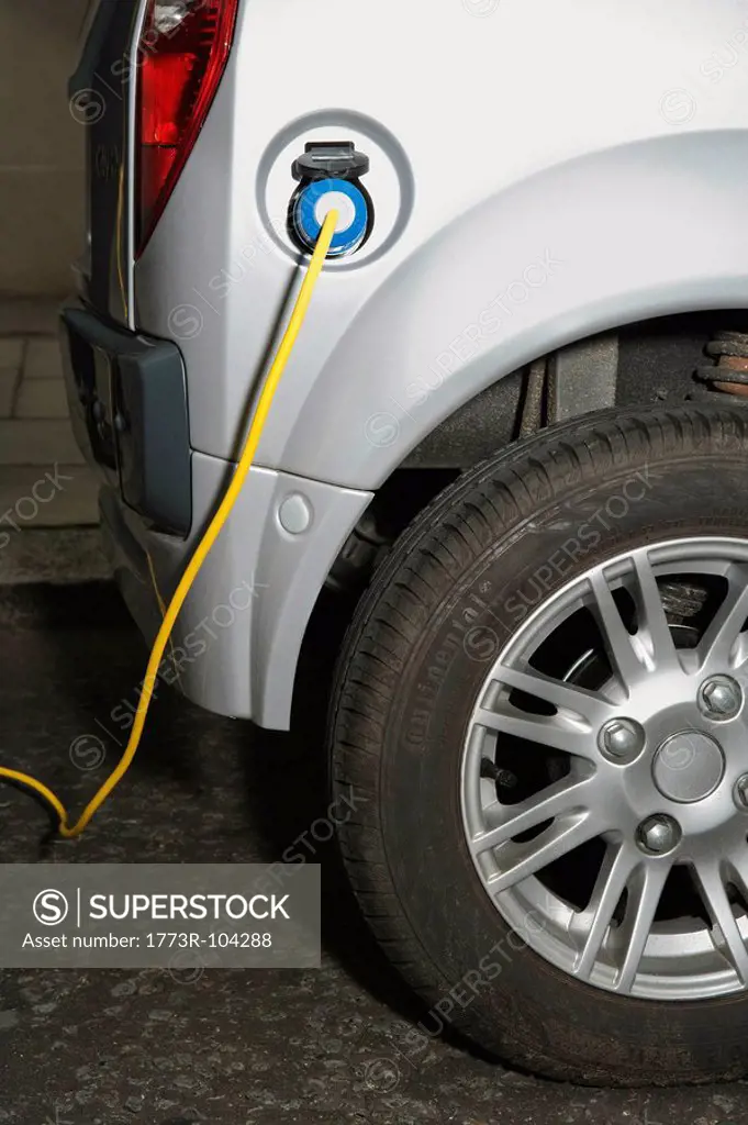Electric cable attached to electric car