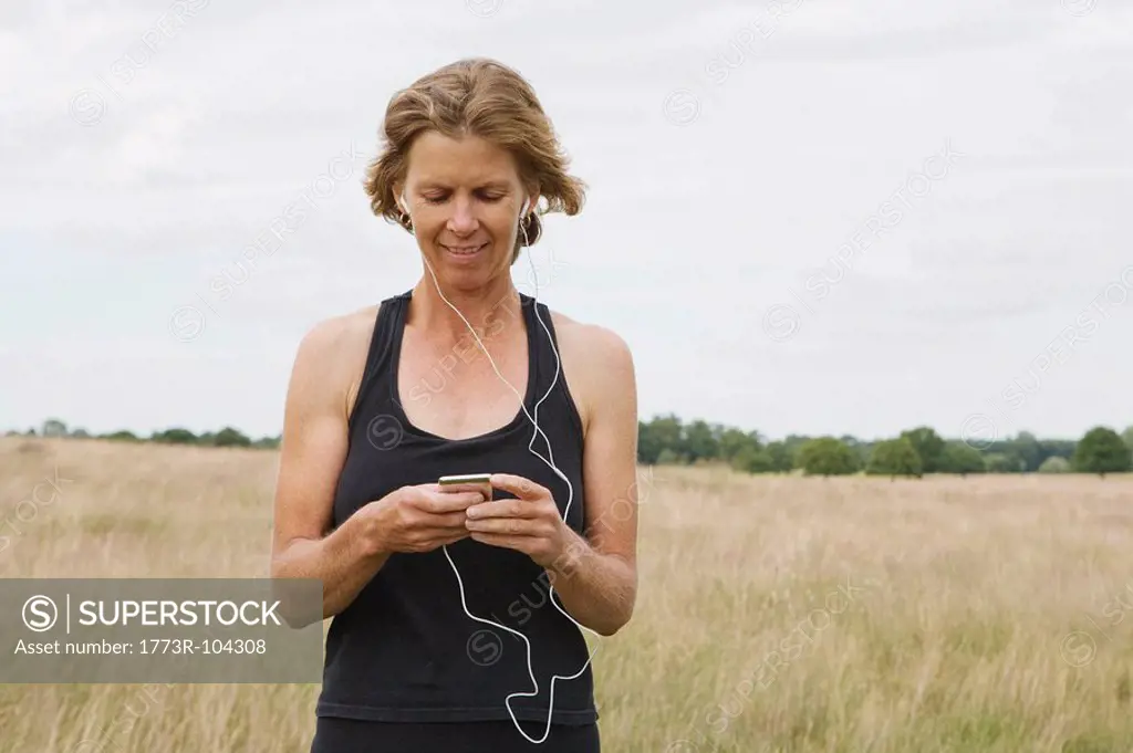 Woman runner listening to music