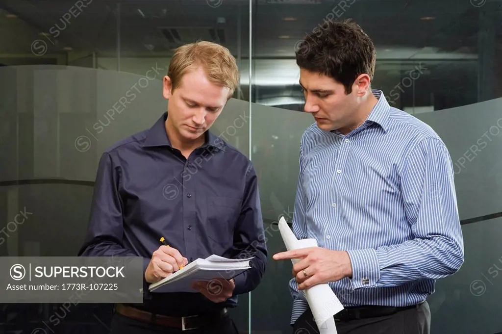 Two men discussing work