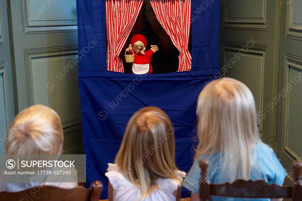 Kids watching a puppet show