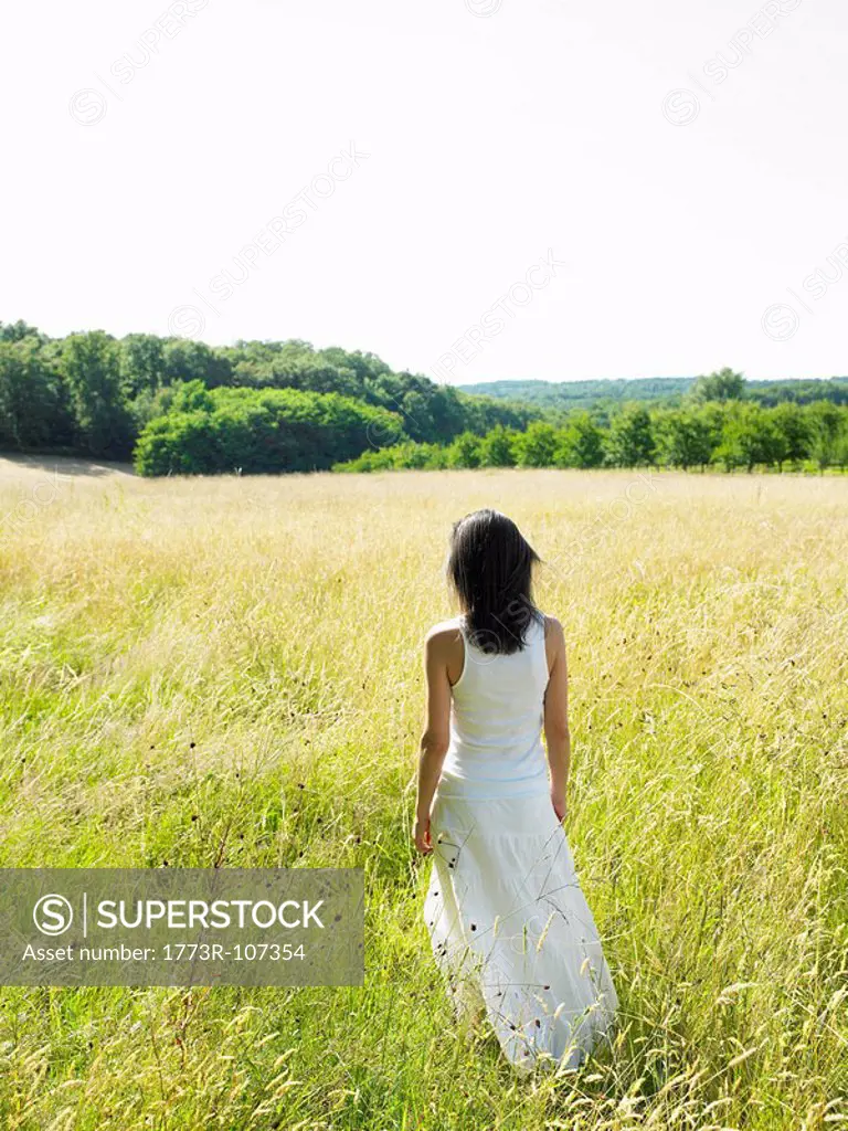 Woman walking in a field