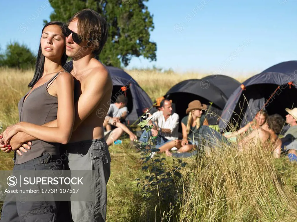 Couple at a festival, backpacking tents