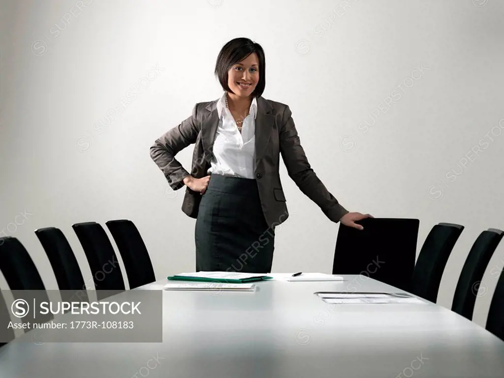 Business woman by conference table