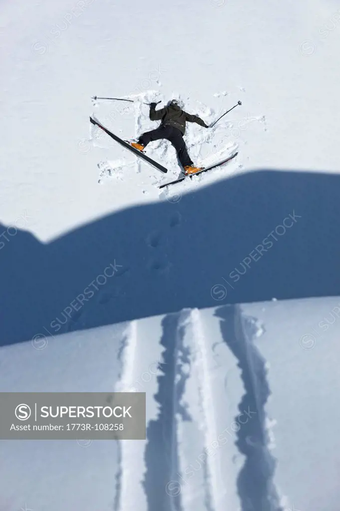 Skier head down in snow