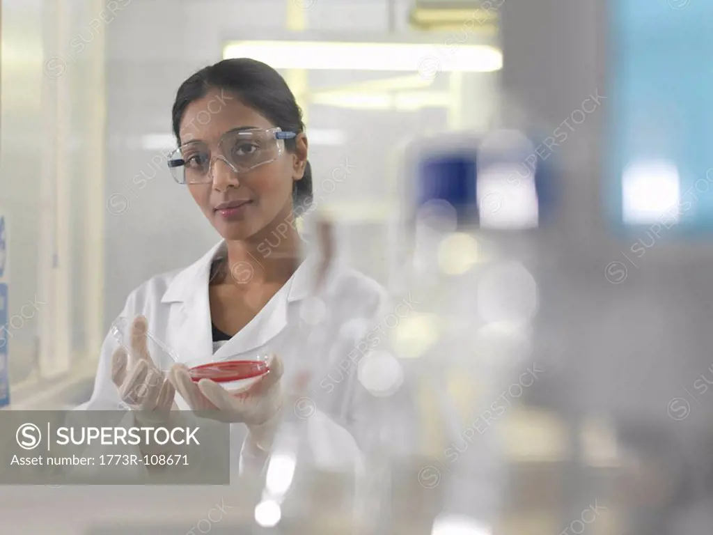 Laboratory technician with petri dish