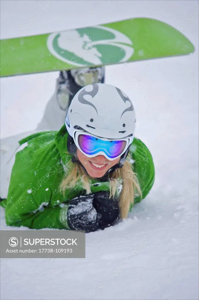 Snowboarder lying in the snow