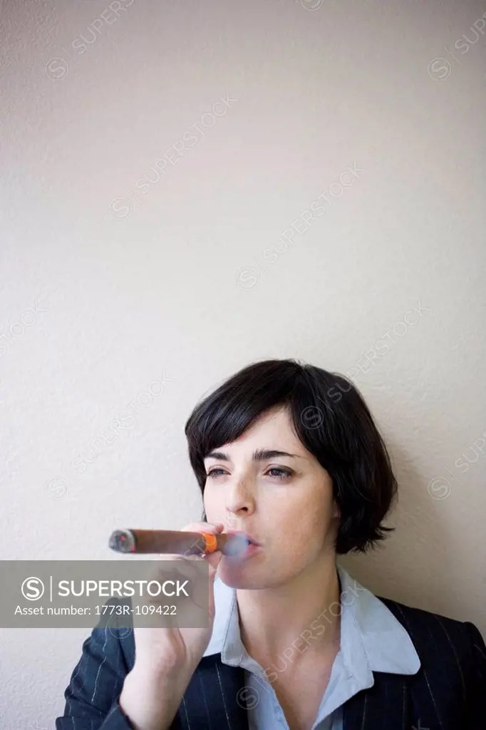 businesswoman smoking cigar