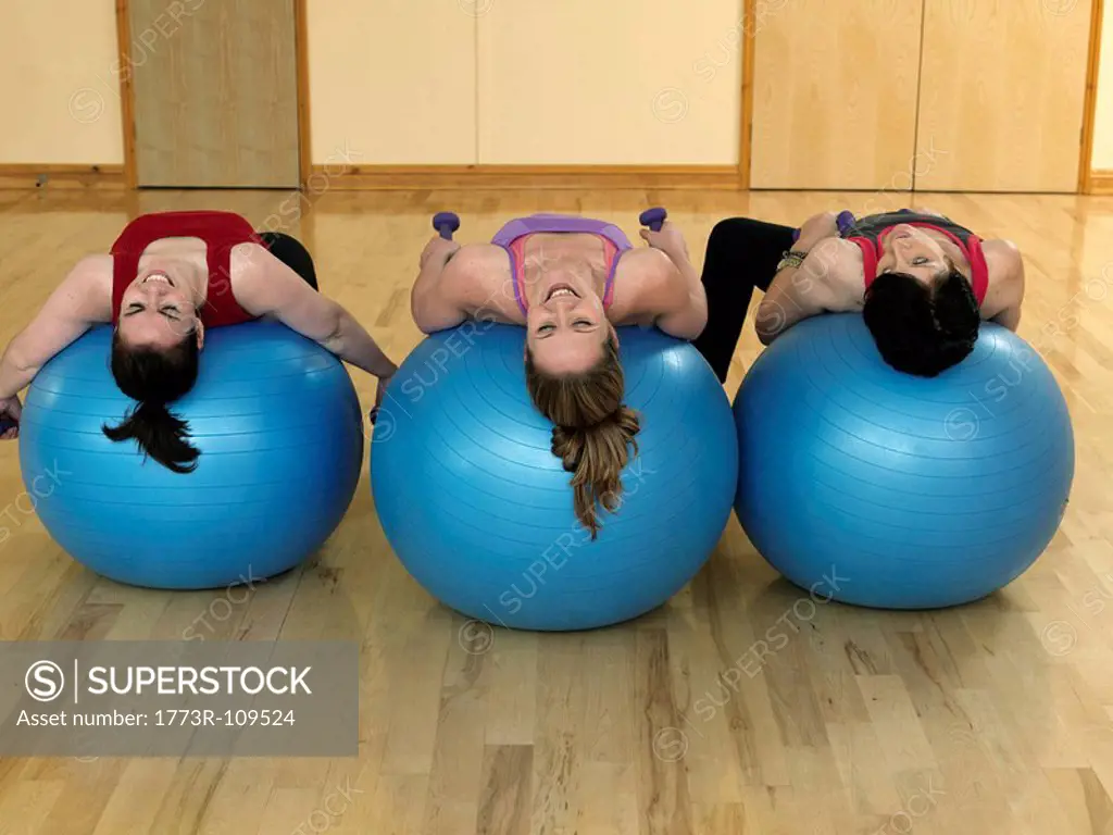 women relaxing on gym balls