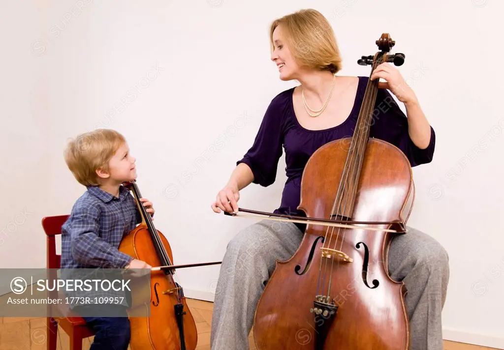 pregnant woman and boy playing Cello