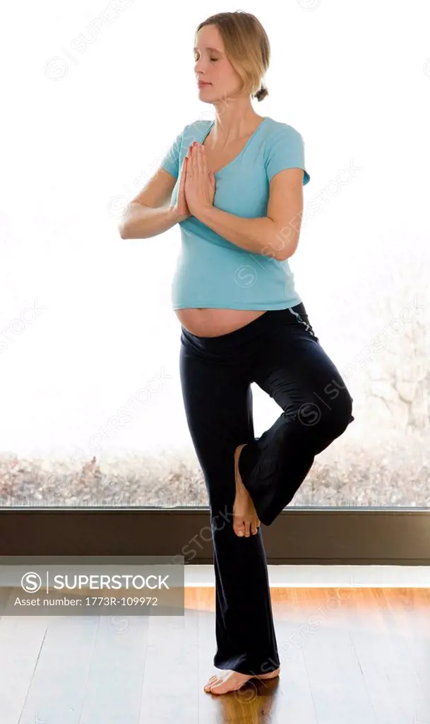 pregnant woman doing yoga exercises