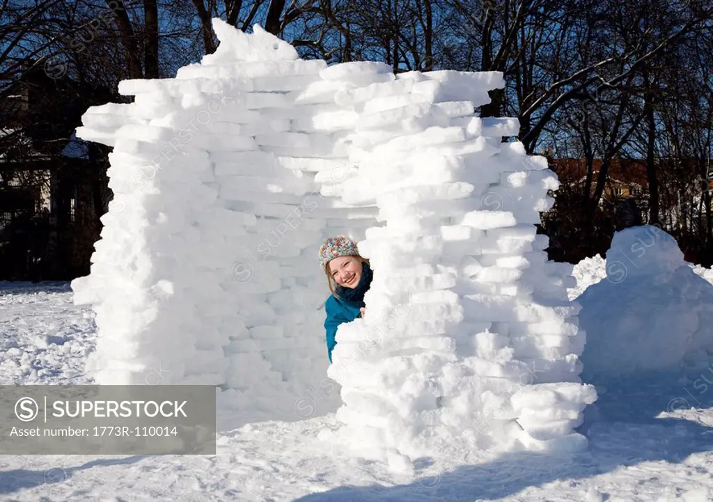 Girl in igloo in the snow