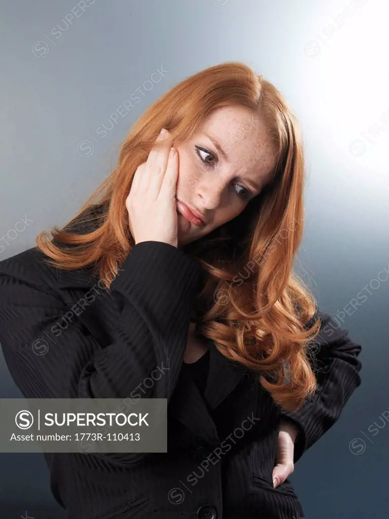 Office worker looking thoughtful