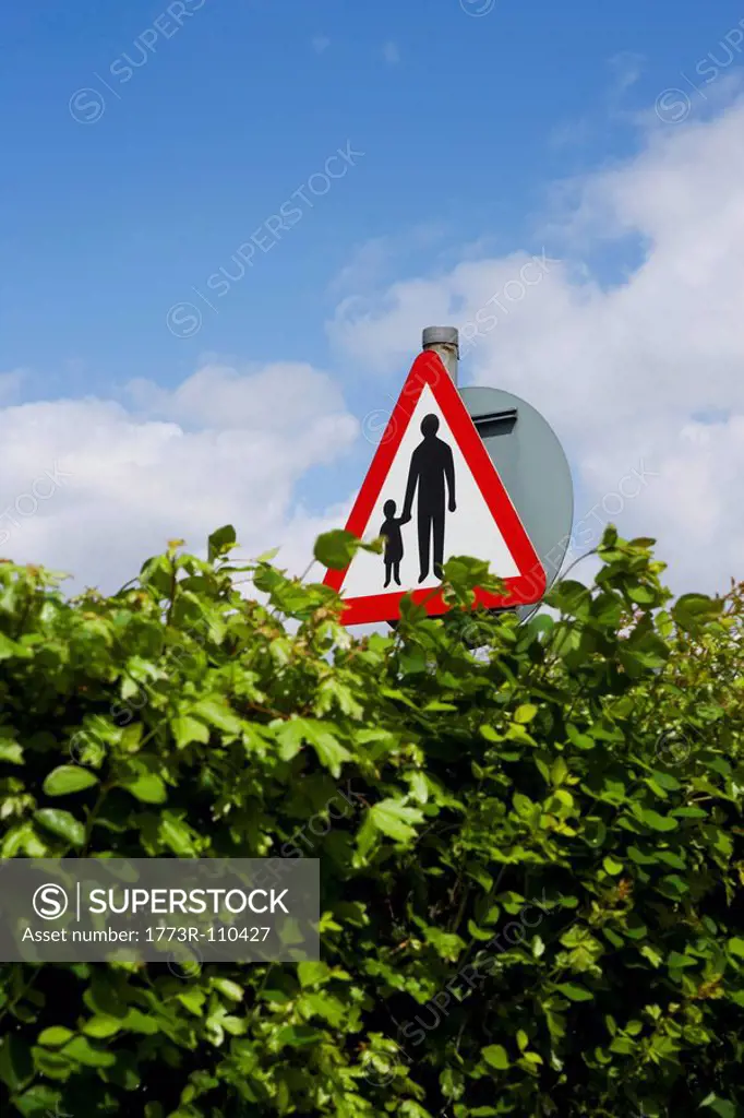 Adult child warning road sign