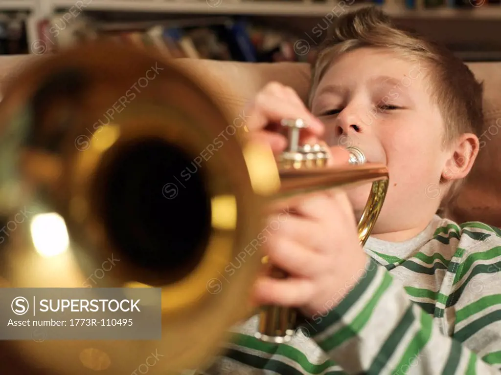 Boy, 11 playing trumpet