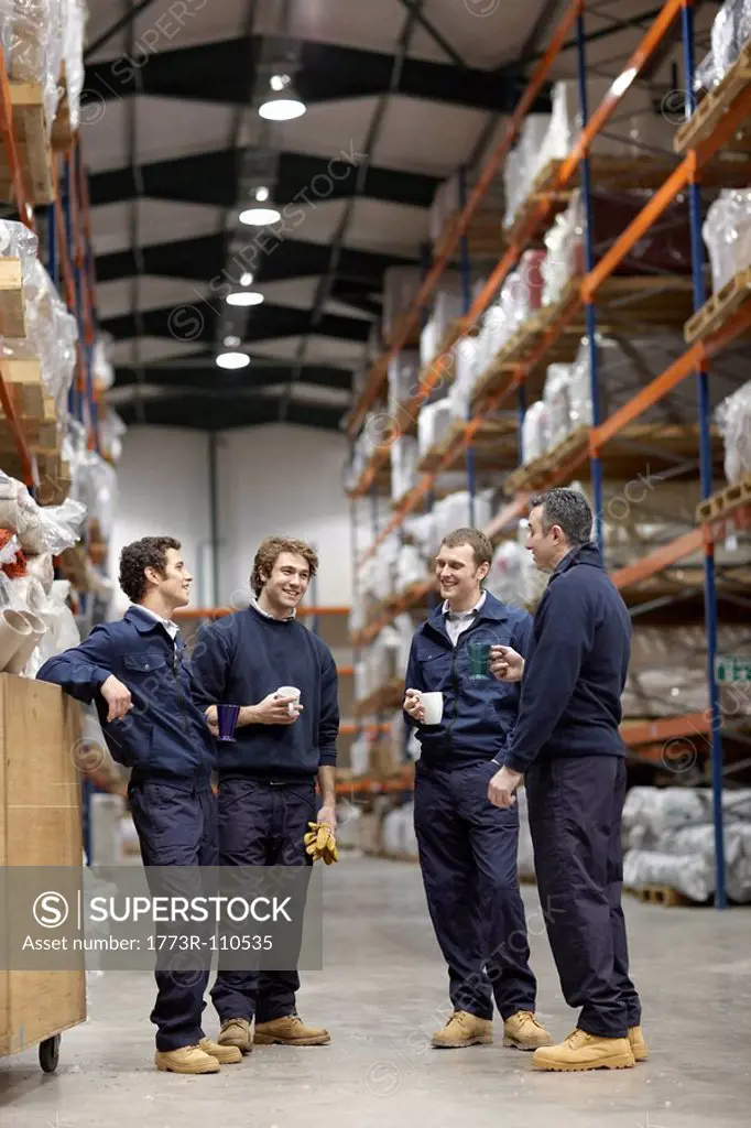 Workers in warehouse having break