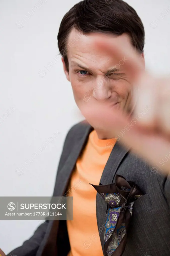 man showing a gesture to viewer
