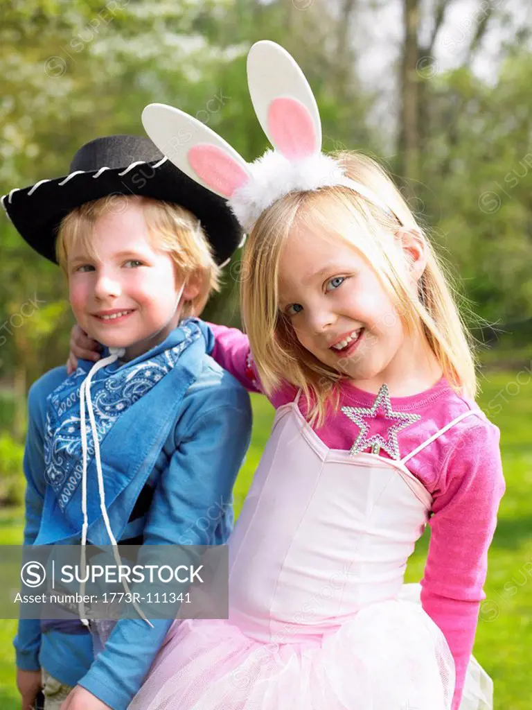 Boy and girl wearing costumes