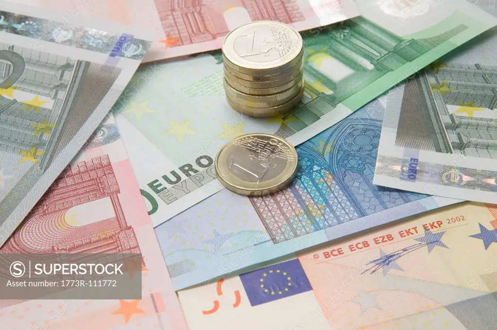 Euro currency and a stack of coins