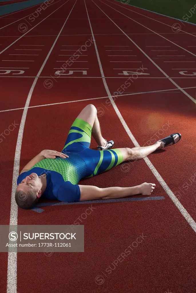 athlete lying on track