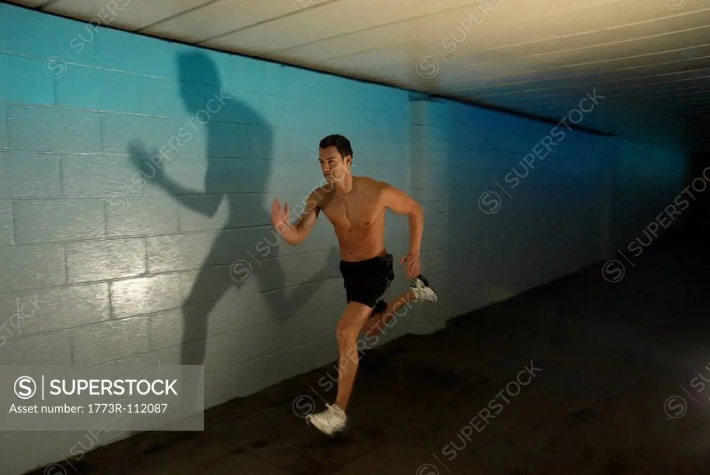 man running in tunnel