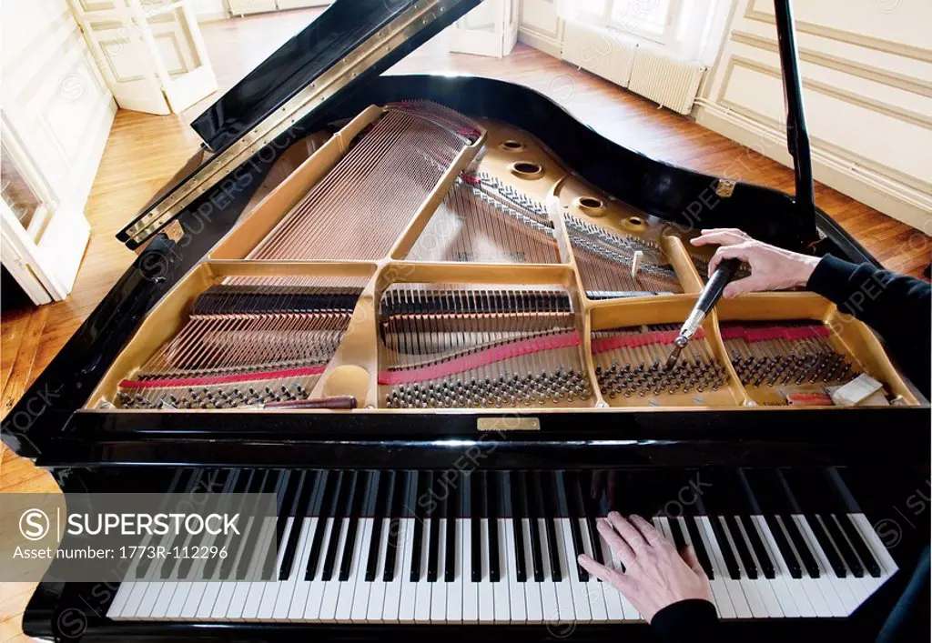 Piano being tuned