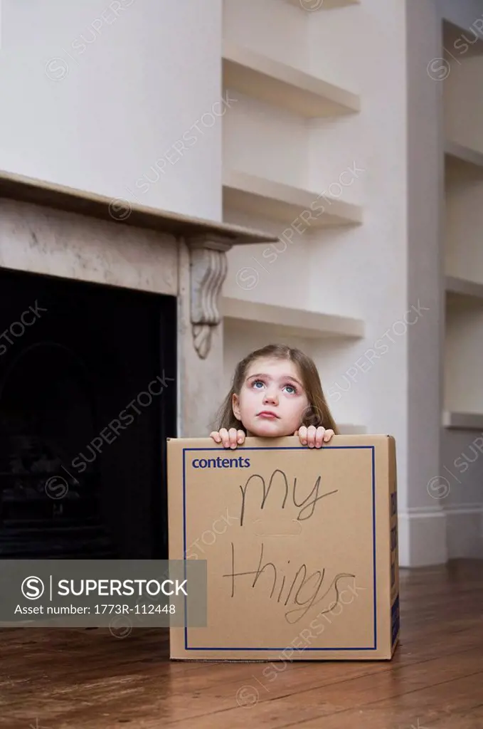 Child sitting in Box.