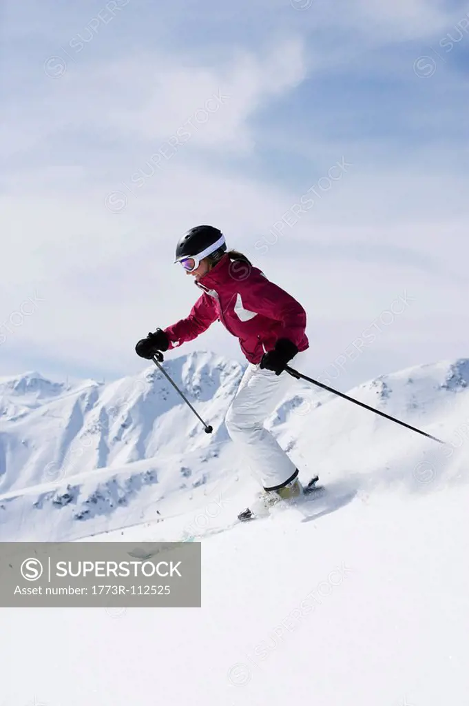 Woman in red & white outfit off_piste.
